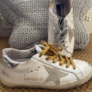 Golden Goose gold and silver shoes